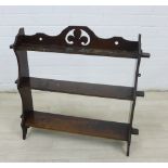 Mahogany wall shelves with fleur de lys motif, 62 x 67cm