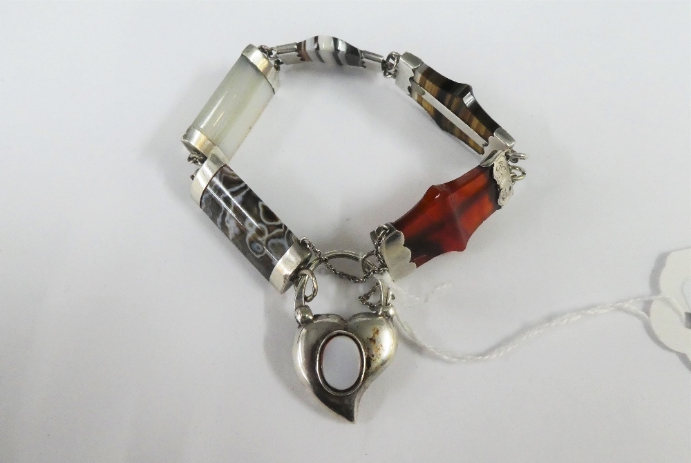 Scottish hardstone and banded agate bracelet with white metal mounts and heart shaped clasp /