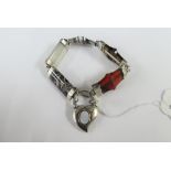 Scottish hardstone and banded agate bracelet with white metal mounts and heart shaped clasp /