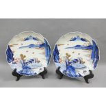 Pair of Chinese blue and white plates, with crimped rims and painted with a village landscape