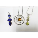 Two silver pendants with coloured hardstone and a white metal pendant (3)