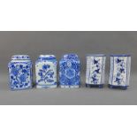 Three Delft blue and white pottery caddies together with a pair f blue and white vases, 12 cm