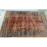 Pakistan rug with a rust field, fringed ends, 250 x 154cm