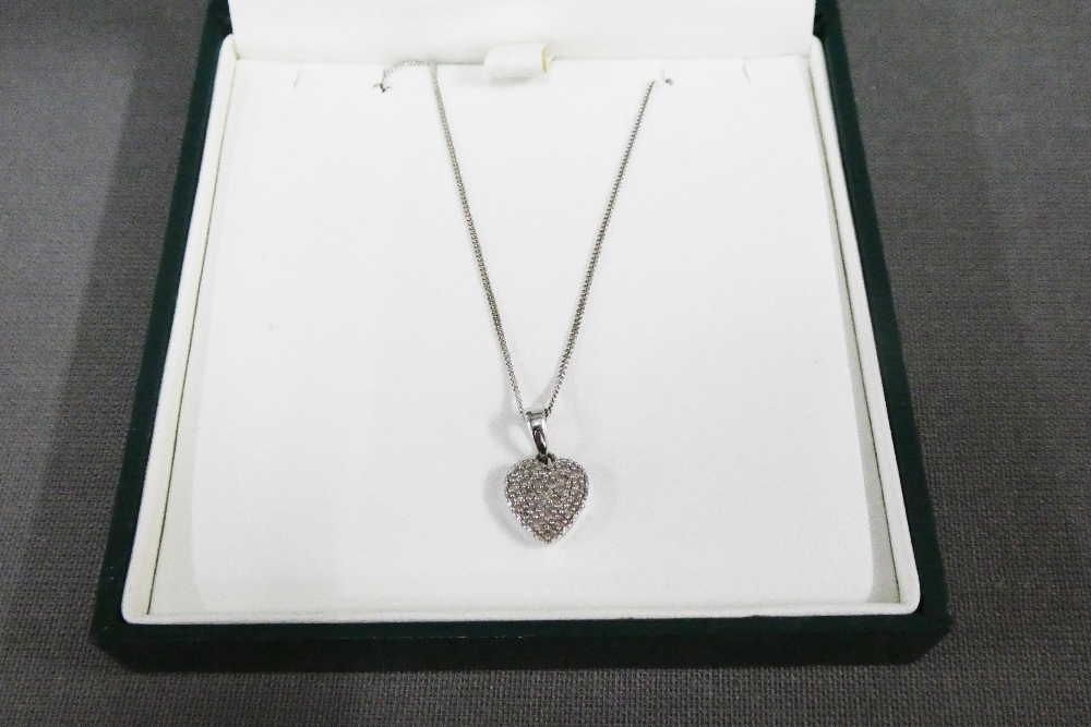 9ct white and diamond heart pendant, on chain