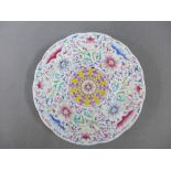 Millefiore plate with a central flowerhead medallion, 20cm diameter