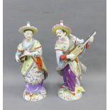A pair of Volkstedt porcelain male and female Musician figures, 21cm high (2)