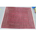 Large Pakistan rug, with red field and fringed ends, 280 x 360cm