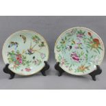 Pair of Chinese Celadon glazed insect and butterfly pattern plates, fritting to rims, largest 19cm