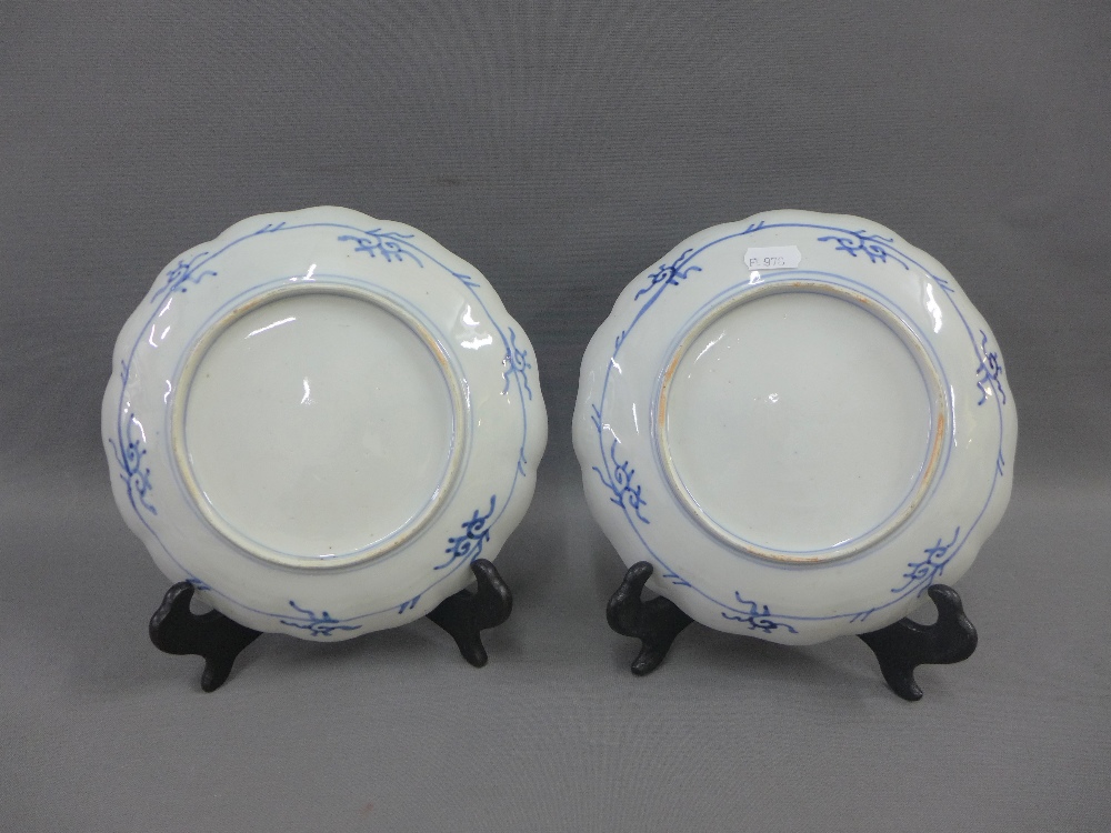 Pair of Chinese blue and white plates, with crimped rims and painted with a village landscape - Image 3 of 3