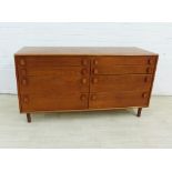 Meredew mid century teak sideboard / chest, with an arrangement of eight long drawers, with oval
