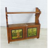 Early 20th century pine wall hanging shelf with a pair of Nursery Rhyme doors, 64 x 59cm