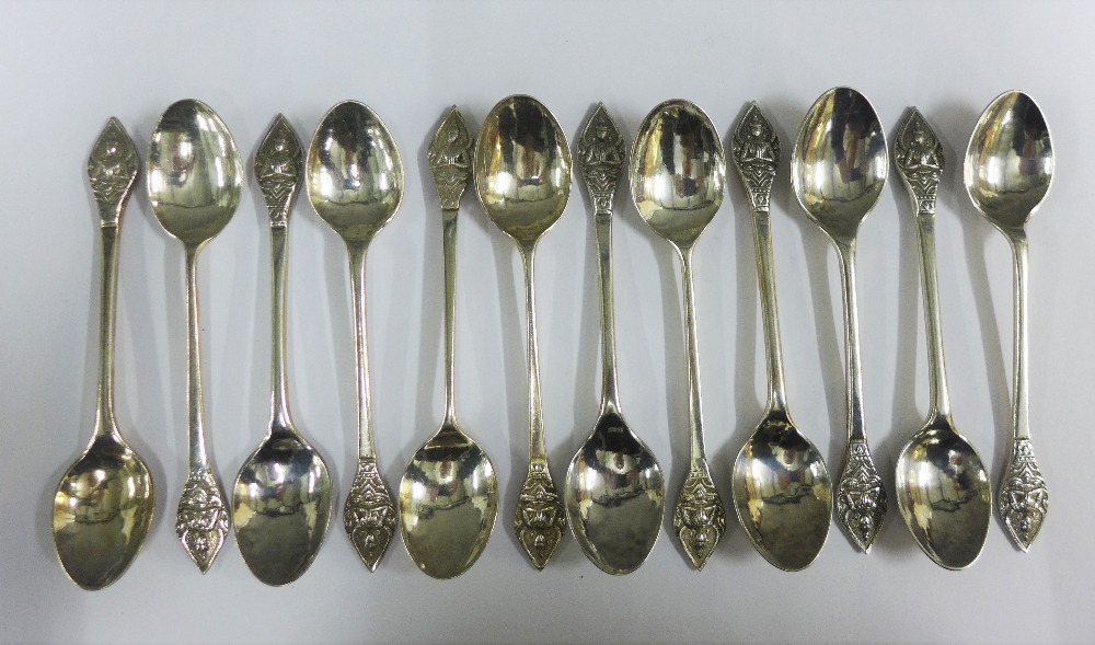 Set of twelve Eastern white metal spoons, (12)