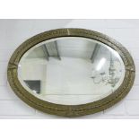 Oval brass framed wall mirror, 50 x 70cm