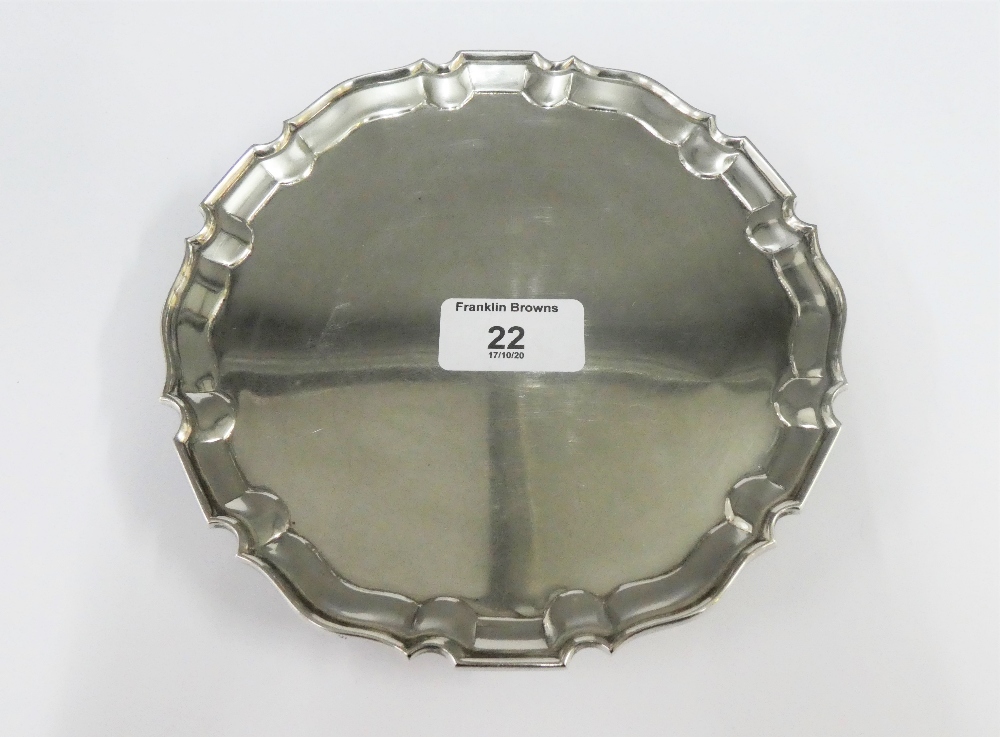 An Edwardian silver salver, Daniel & John Wellby, London 1901, with Chippendale border and three