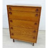 Meredew mid century teak chest, with five graduated long drawers and oval teak handles, on turned