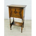 Early 20th century oak bedside / pot cupboard, with fall front, turned legs and an undertier, 72 x