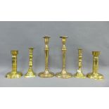 Three pairs of brass candlesticks, tallest 25cm high (3)