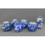 Seven various blue and white prunus pattern ginger jars and a blue and white vase, tallest 19cm (8)