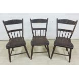 Set of three ebonised pine chairs with fruit painted toprails, spindle back and solid seats, 80 x