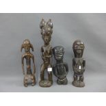 Four carved wooden African figures, tallest 46cm (4)