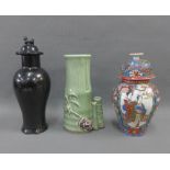 Chinese black glazed vase and cover with dog finial together with a celadon glazed bamboo vase,