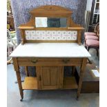 Arts & Crafts oak washstand with tiled and mirror back and marble top over a pair of cupboard doors,