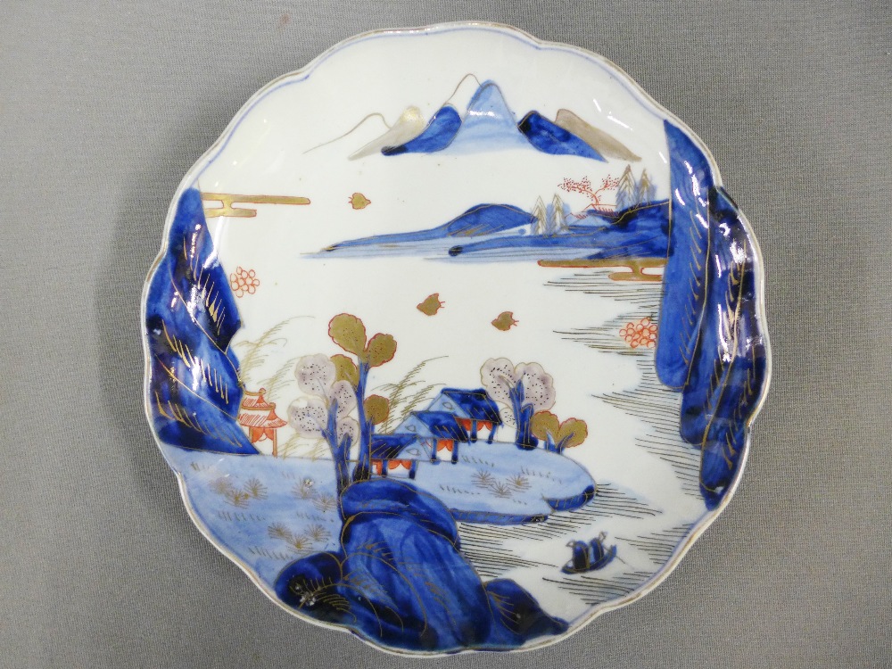 Pair of Chinese blue and white plates, with crimped rims and painted with a village landscape - Image 2 of 3