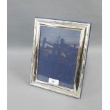 Modern silver photograph frame, London 1994, of rectangular outline, with strut back, 20 x 26cm