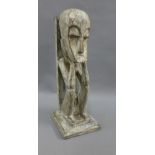 Carved wooded tribal figure, on a square base, 30cm high