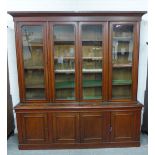 19th century oak bookcase cabinet, the pediment top over four glazed doors with a shelved