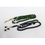 Two sets of Islamic Rosary prayer beads to include black onyx and nephrite with yellow metal spacers