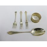 Chester silver napkin ring, Sheffield silver spoon and three silver pickle forks (5)