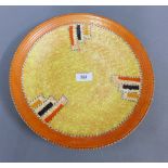 Crown Ducal orange glazed charger, with printed backstamps, 32cm diameter