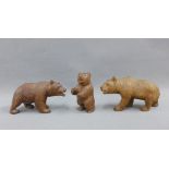 Three Black Forest style carved wooded bears, tallest 9cm (3)