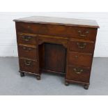 Mid 18th century and later yew wood kneehole desk, with long drawer and three short drawers to