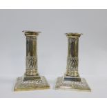 A pair of Edwardian silver Corinthian column candlesticks, Thomas A. Scott, Sheffield 1902, with