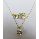 Two 14ct gold pendants, another gilt metal pendant and a yellow metal chain (4)