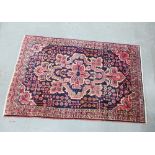 Persian rug with red ad blue foliate field, 138 x 212cm