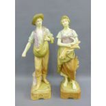 A pair of Royal Dux style Agricultural figures, each modelled standing on a square base, with