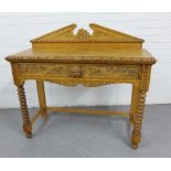 Carved oak side table, with a broken pediment ledgeback, single frieze drawer, bobbin legs and