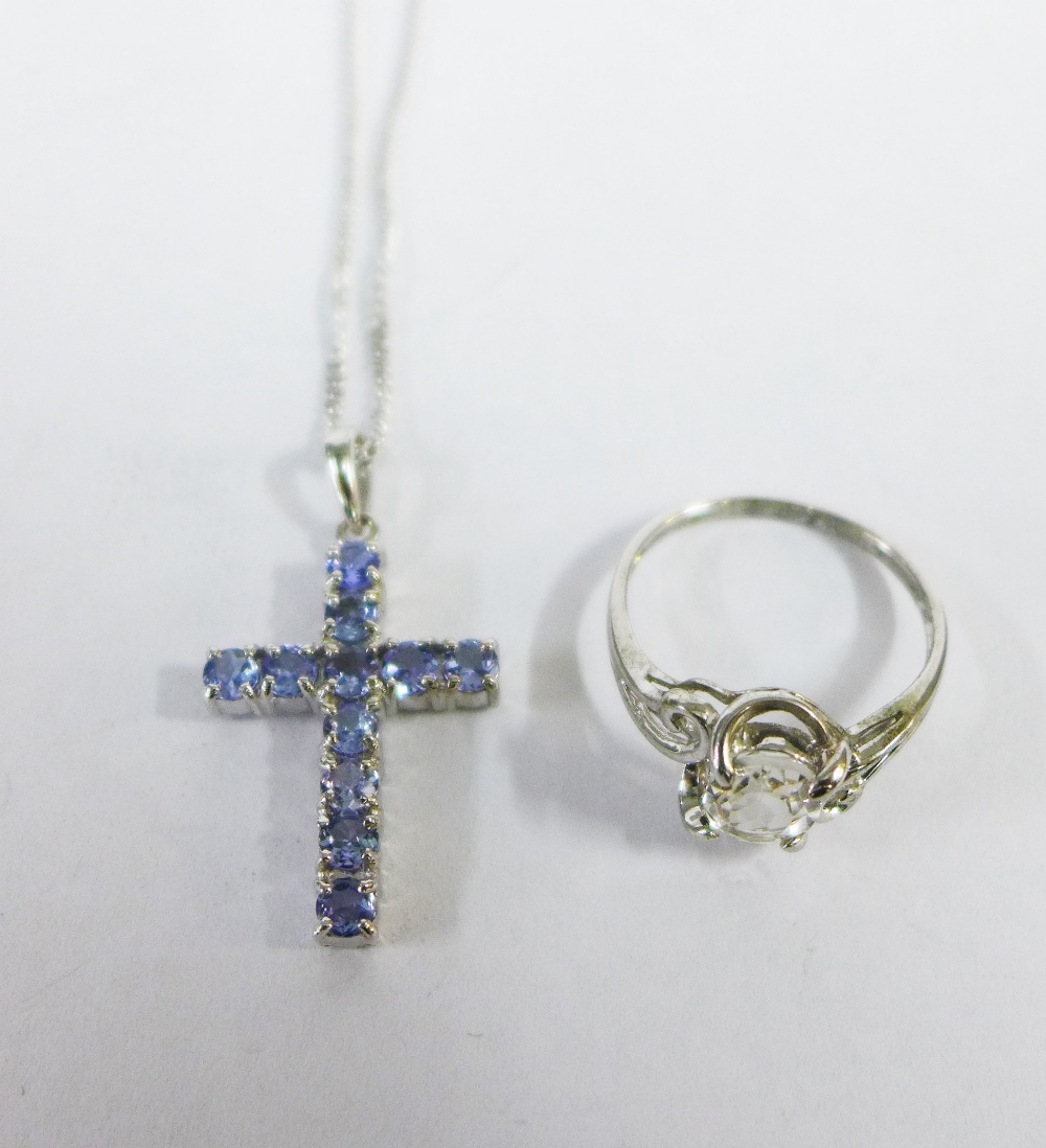 9ct white gold tanzanite crucifix pendant on a 9ct white gold chain together with a silver dress