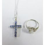 9ct white gold tanzanite crucifix pendant on a 9ct white gold chain together with a silver dress