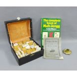 Mahjong set, in a leather cased together with The complete book of Mahjong, etc