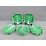 Set of eight Portuguese leaf moulded, green glazed plates, (8)