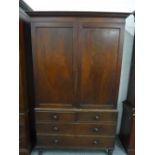 Georgian mahogany linen press, the stepped cornice above a pair of cupboard doors with a fitted