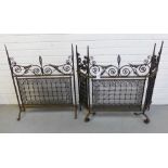 Two steel spark / fire guards, with scrolling feet and twisted finials, largest 79 x 75cm 92)