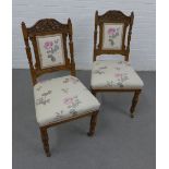 Pair of early 20th century oak framed side chairs with foliate carved top rails and floral