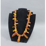 A vintage strand of Baltic amber beads, 65cm