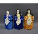 Three Scottish pottery True Spirit of Reform decanters to include Lord John Russell and two Brougham