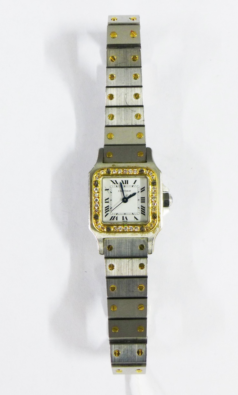 Ladies Cartier Santos wrist watch, with diamond set case, Roman numerals with secret signature at